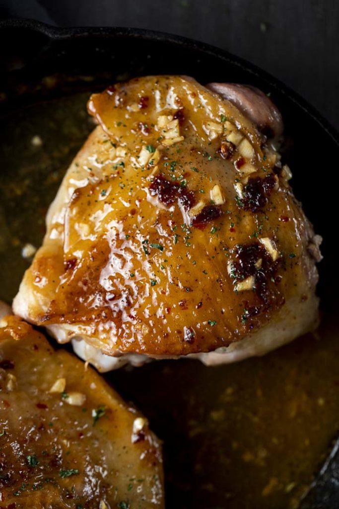 closeup photo of a roasted turkey thigh with glazed skin