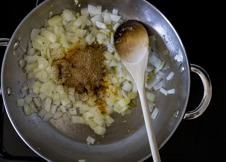 chopped onions and spices in a skillet