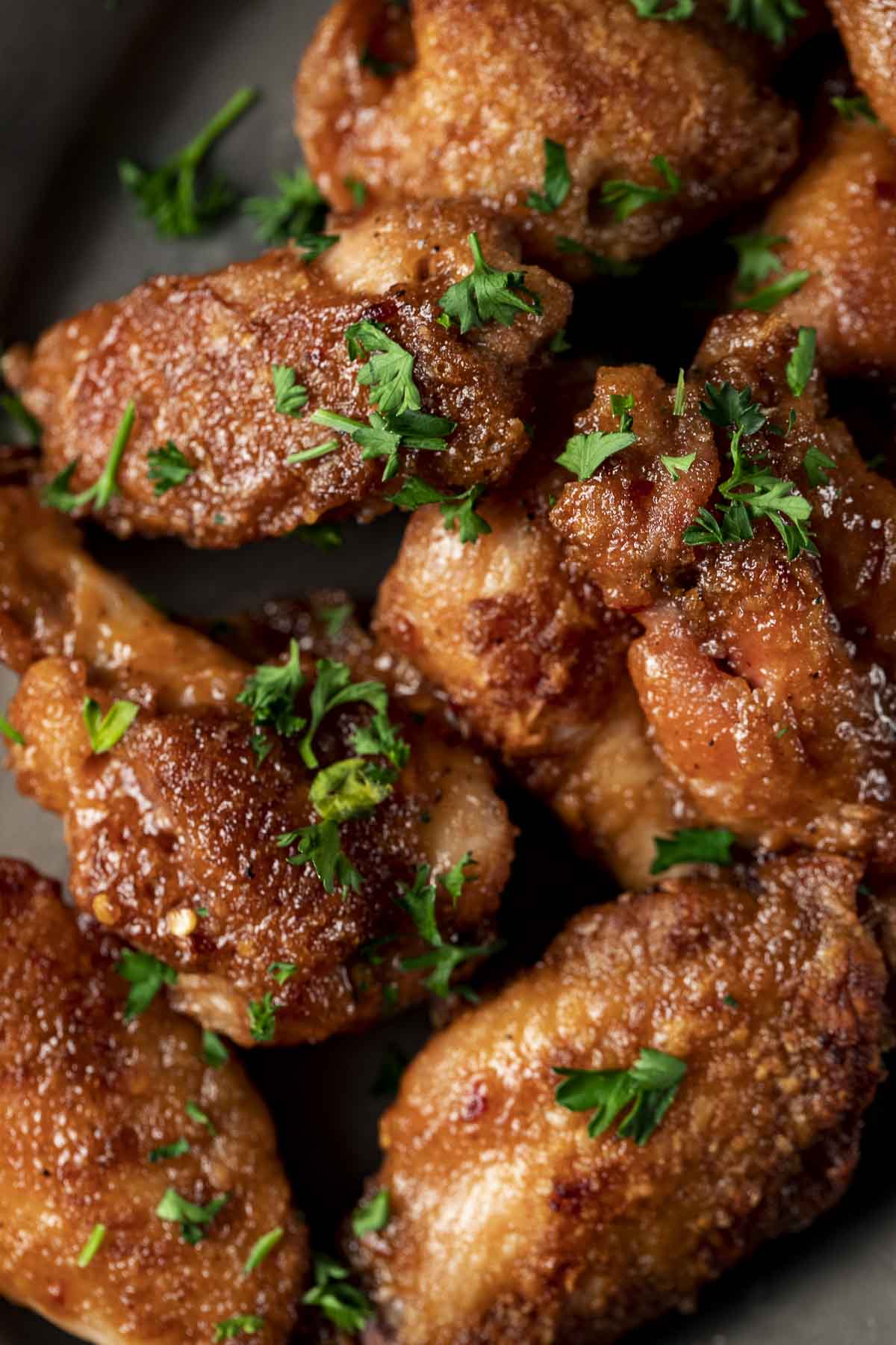 glazed chicken wings with parsley on top