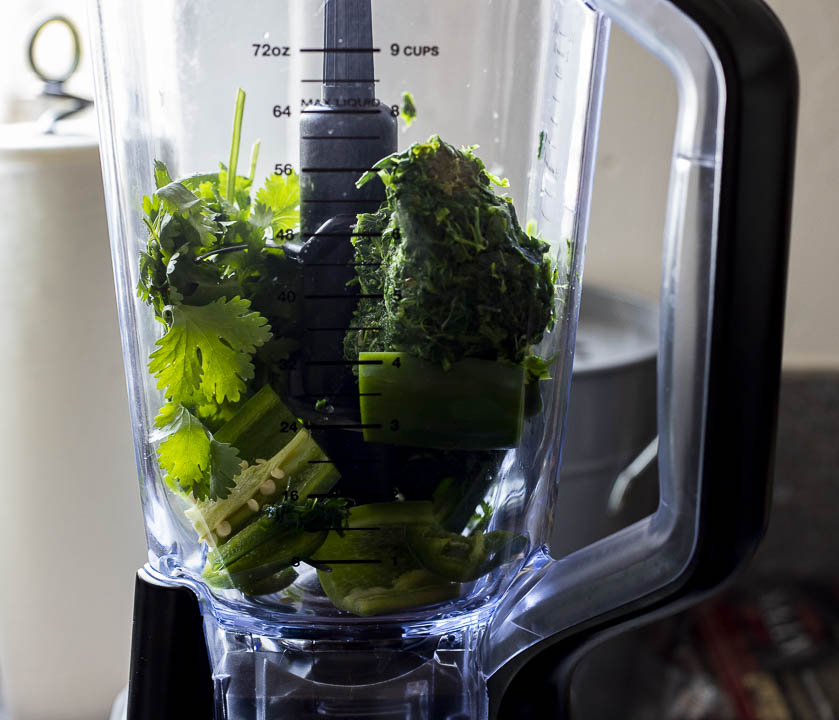 spinach, cilantro and jalapenos in a blender
