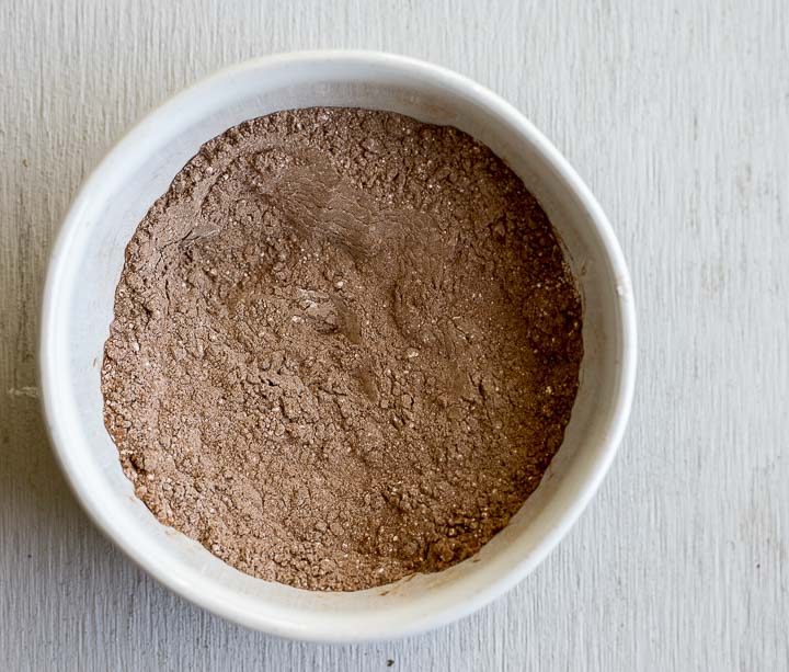 brown powder (cocoa powder) in a bowl