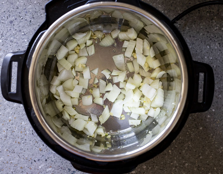 onions sauteing in a pot