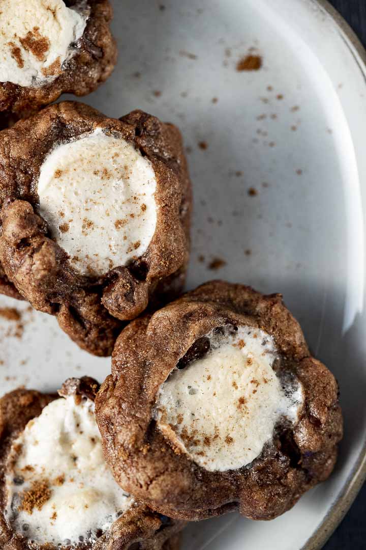 marshmallow stuffed chocolate cookies stacked on a plate