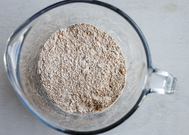 flour and cocoa powder mixed in a measuring cup