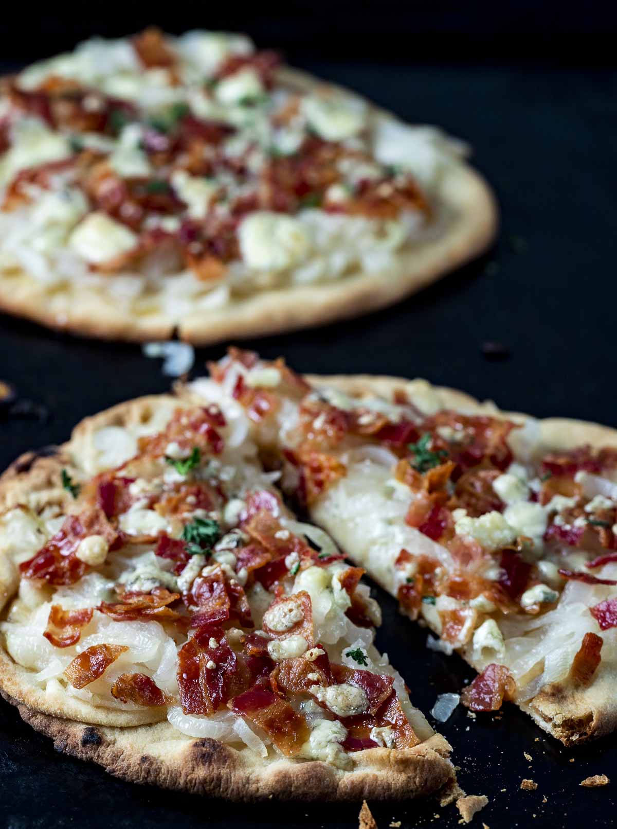 sliced bacon and onion pizza