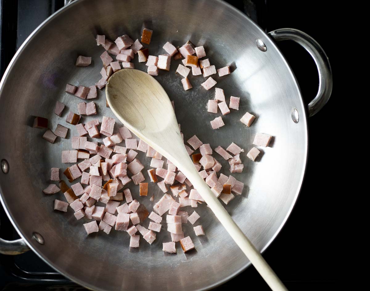 diced ham cooking in a skillet