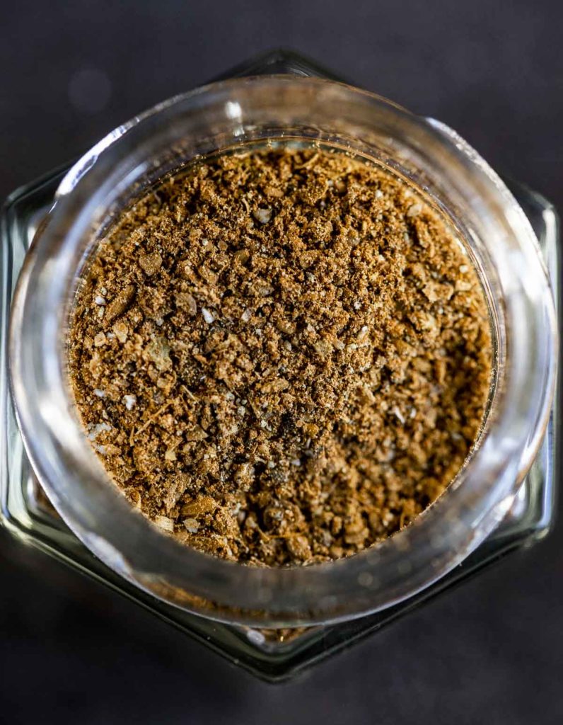 reddish brown ground spices in a jar
