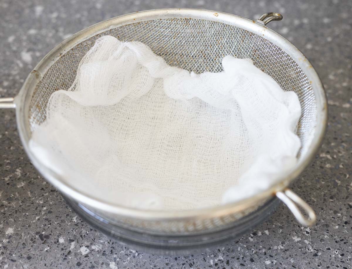 cheesecloth in a strainer