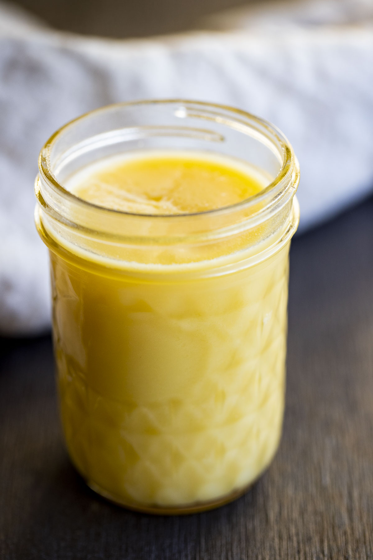 solid yellow ghee in a glass jar