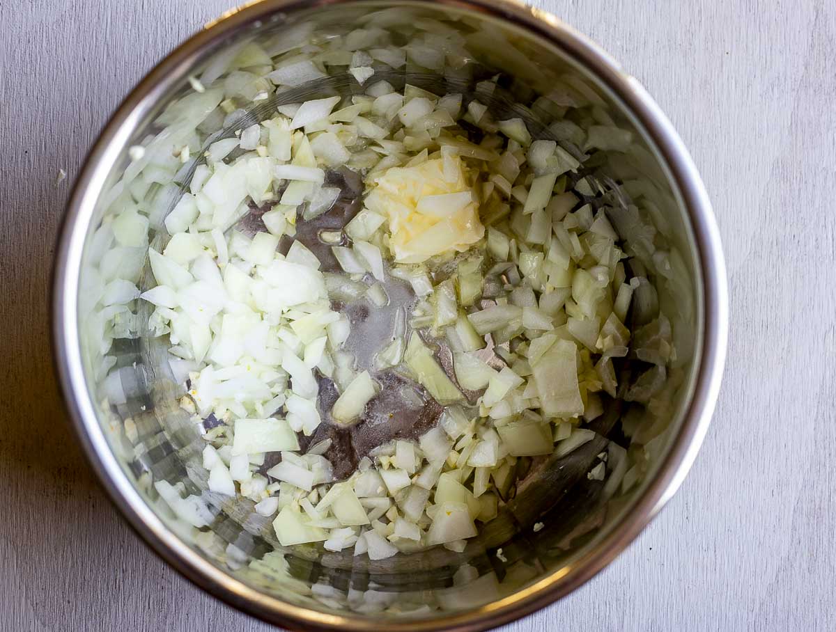 onions and butter cooking in a pot