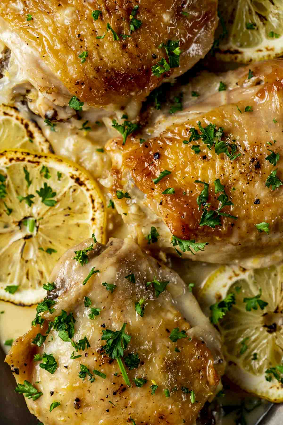 cream sauce and lemons over chicken thighs