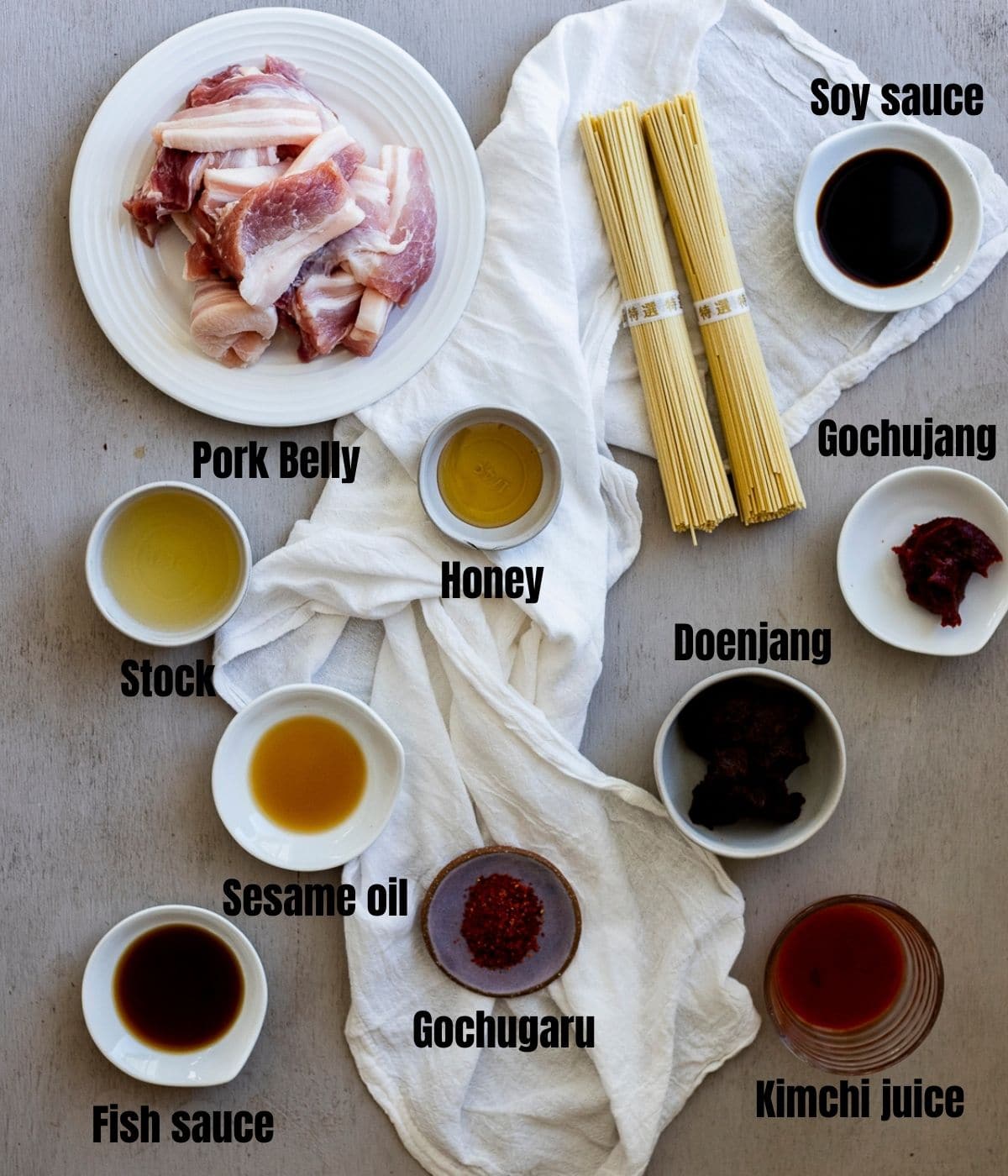 Ingredients to make Korean ramen arranged individually and labelled.