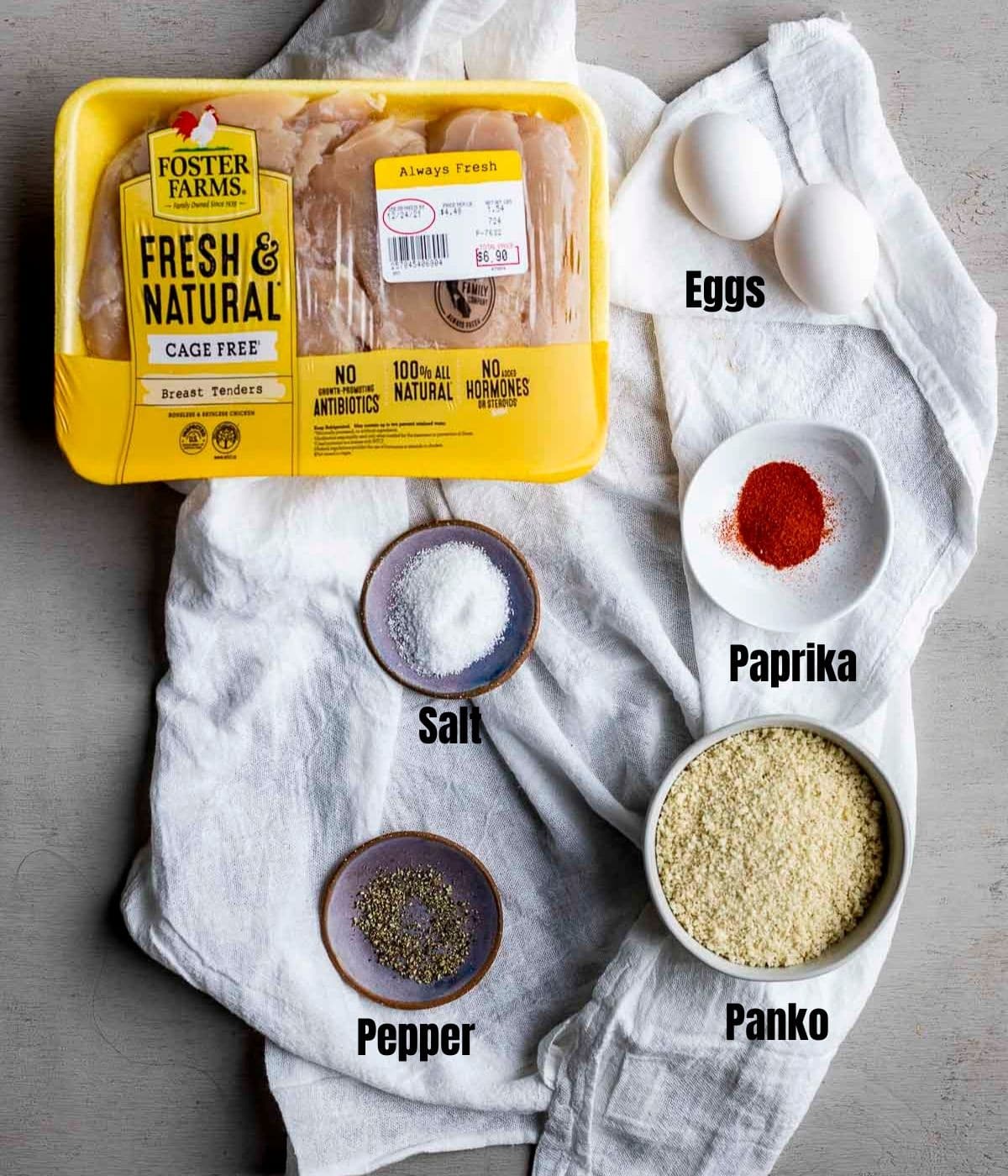 Ingredients to make air fryer chicken tenders arranged individually and labelled.