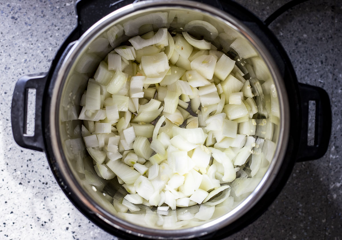 onions sautéing in a pot