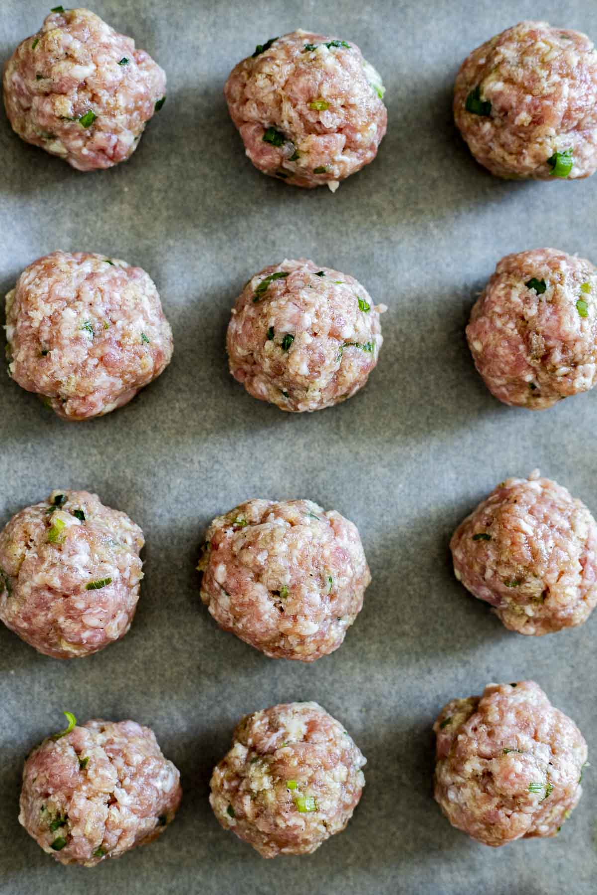 raw pork rolled up into meatballs