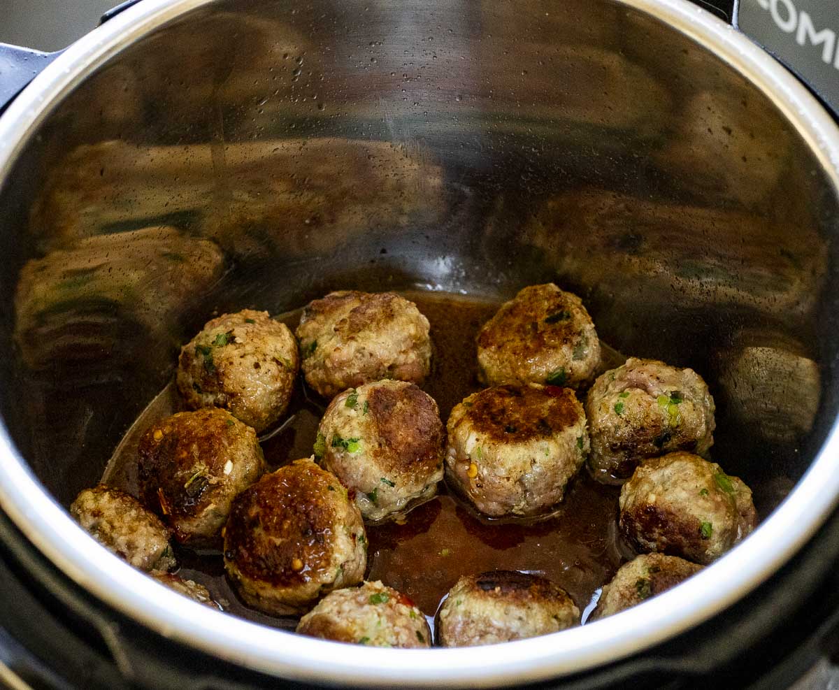 browned meatballs in a pot