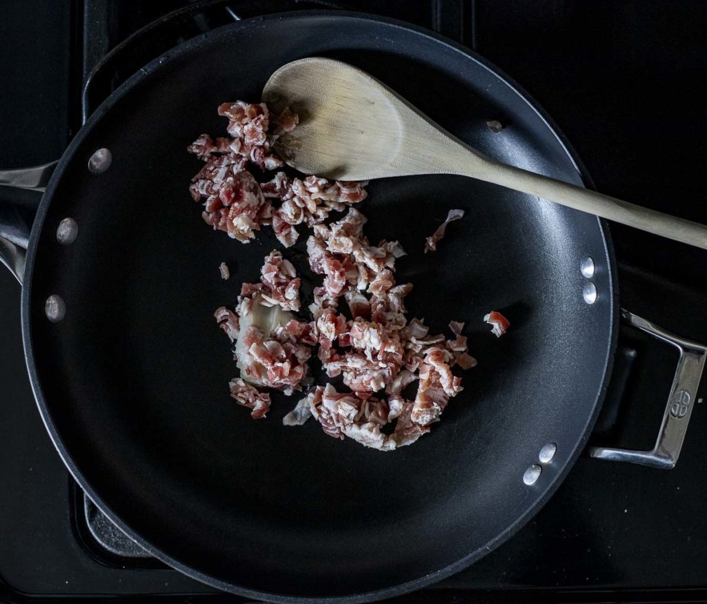 diced pancetta in a skillet