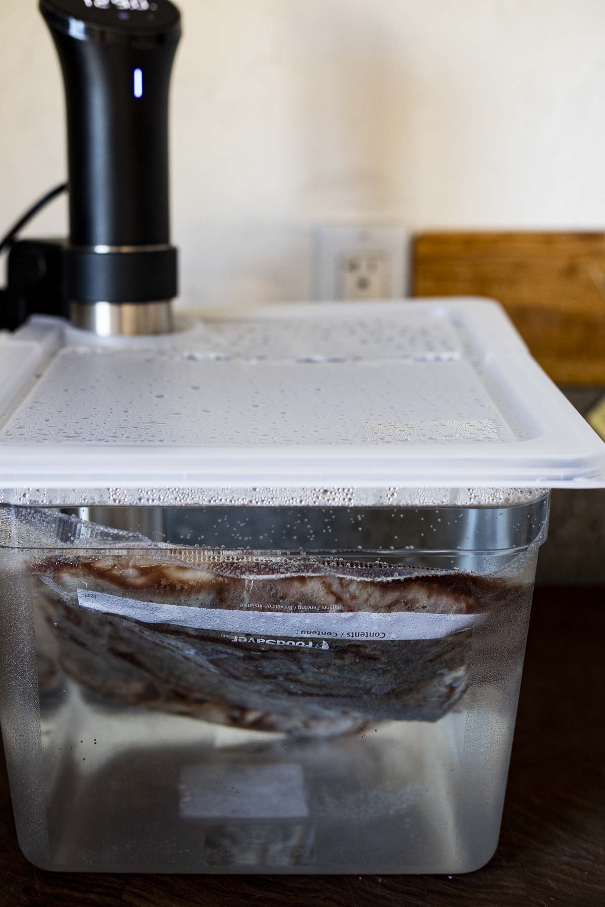 steak in a containerfilled with water and an immersion circulator