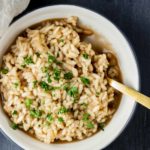 bowl of rice and broth with a spoon