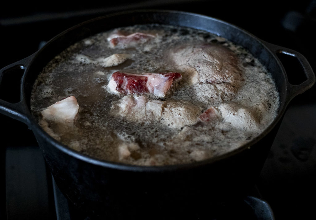 meat boiling in a pot