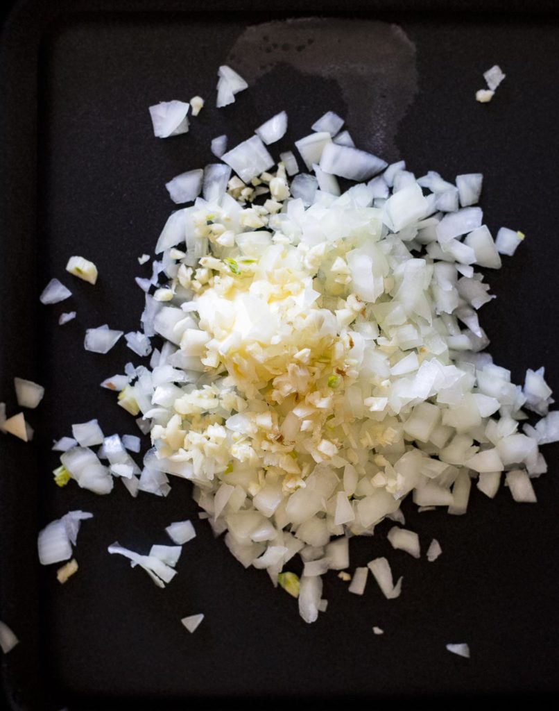 diced onion on a skillet