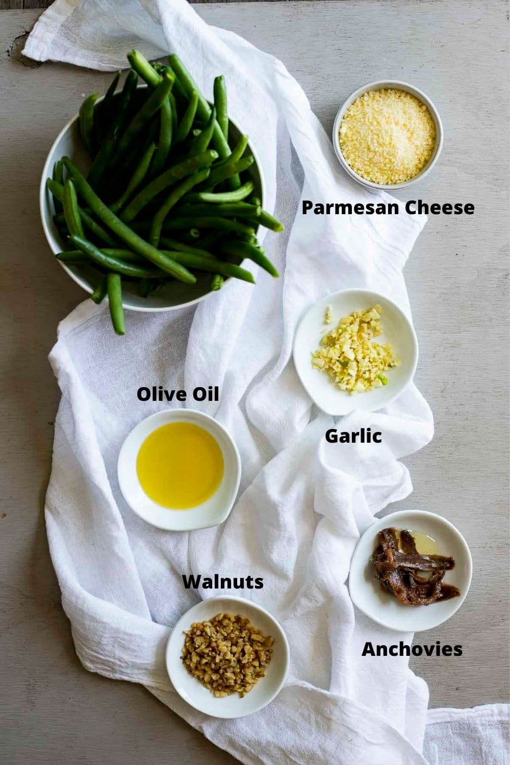 Ingredients to make sous vide green beans arranged individually and labelled.