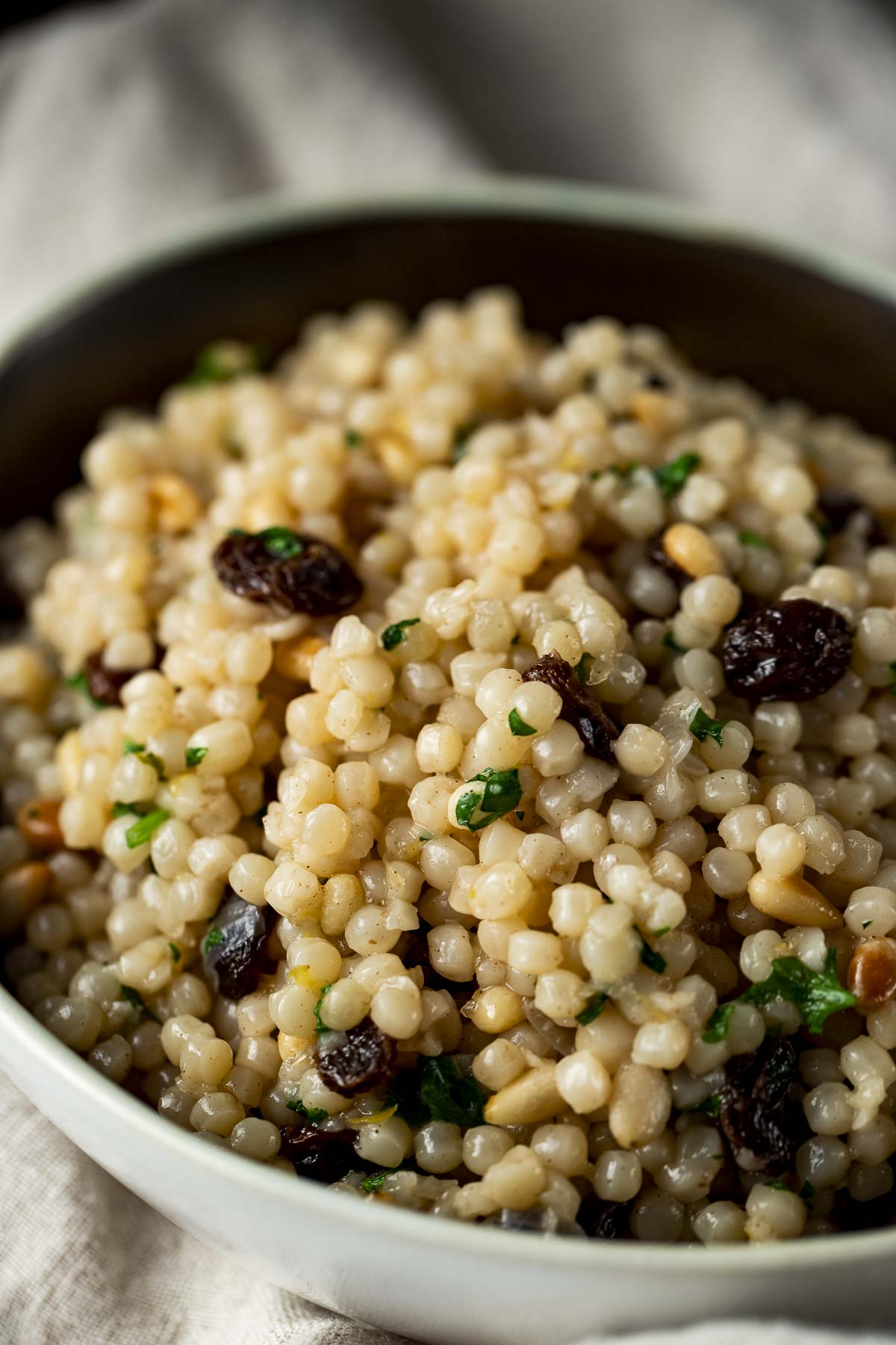 Close up of Instant Pot couscous with pine nuts and raisins.