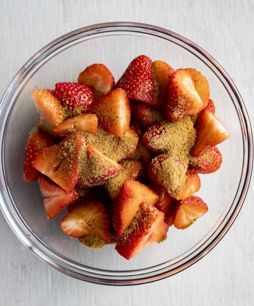 chopped strawberries in a bowl with coconut sugar