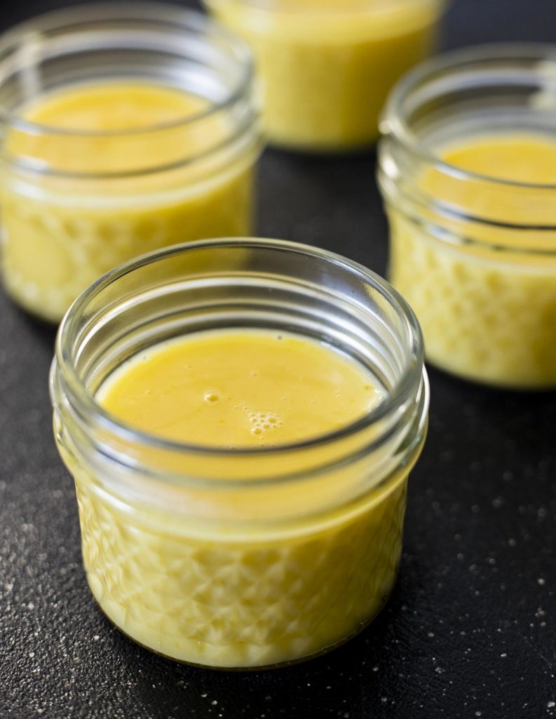 yellow custard in small glass mason jars