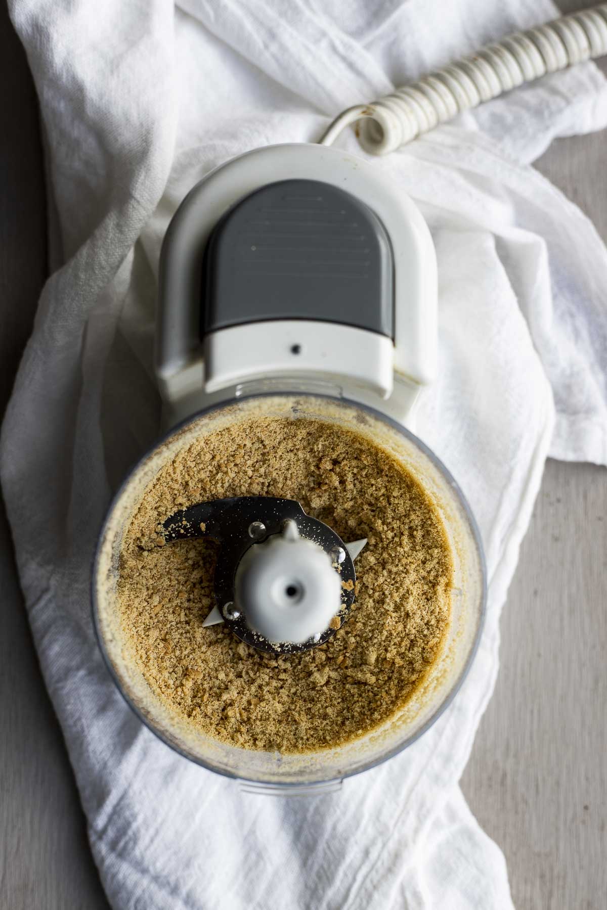 Blending up graham crackers in a food processor.