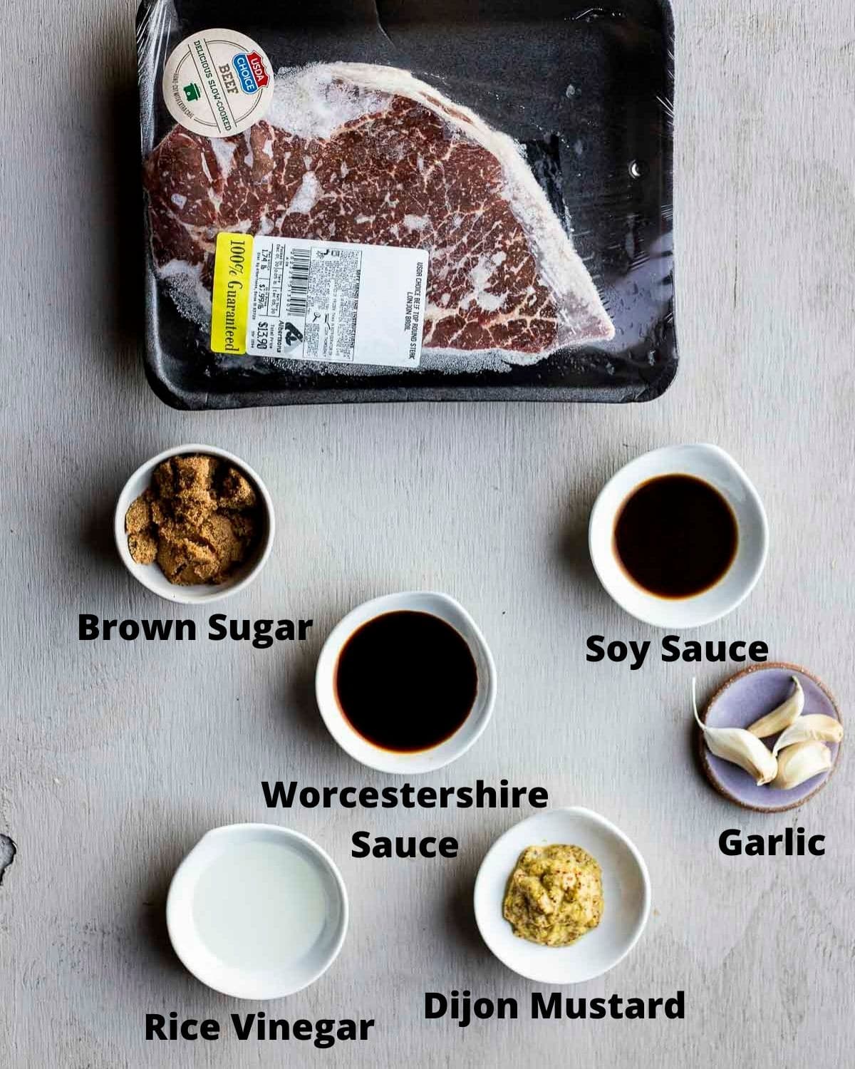 Ingredients to make sous vide London broil arranged individually and labelled.
