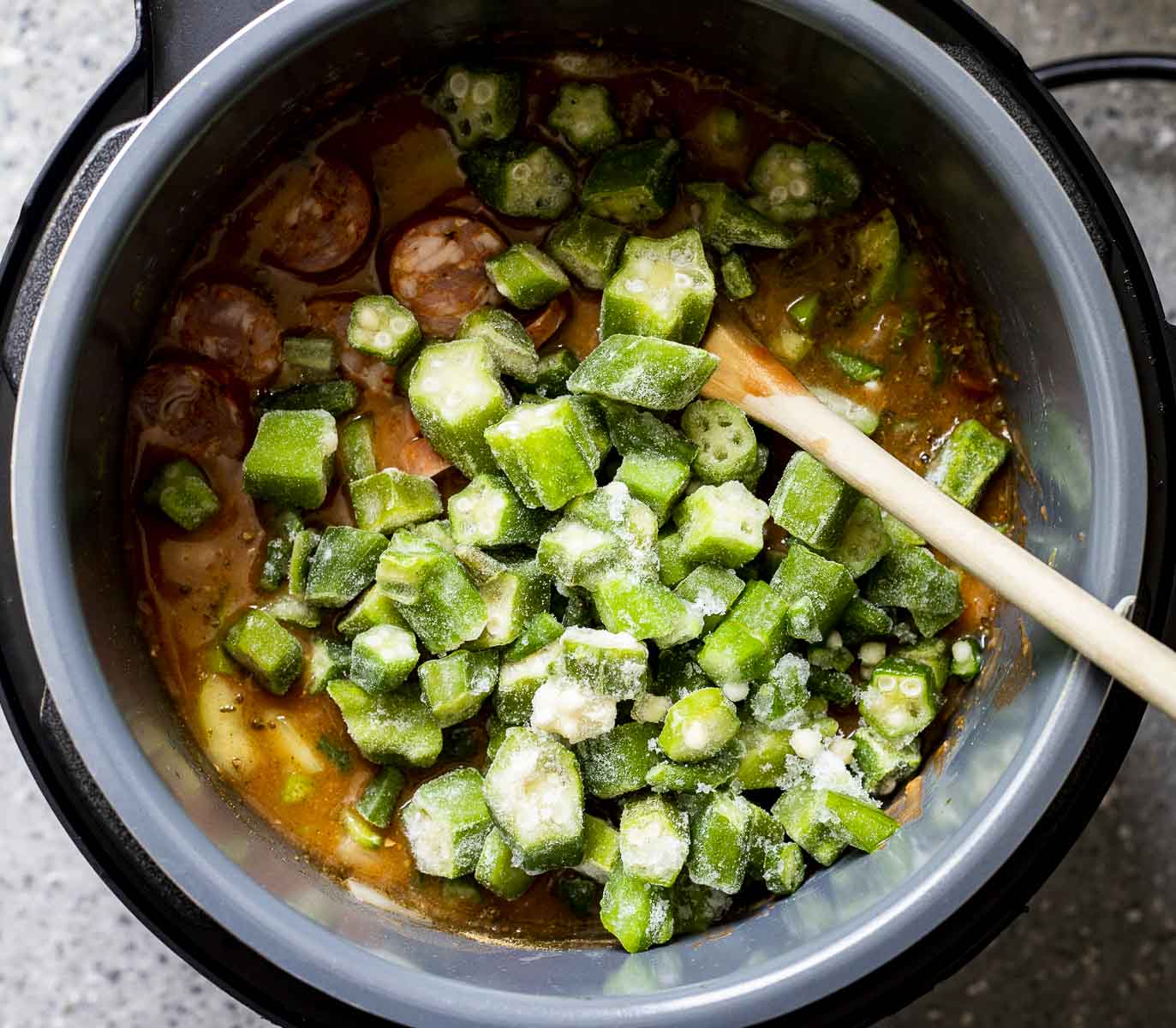 Green pepper, onion and celery added to the gumbo in the Instant Pot insert.