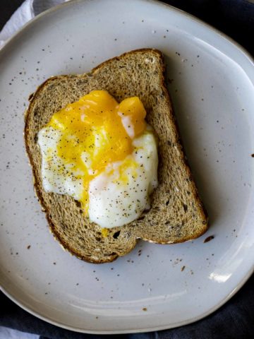 Poached egg over toasted bread.
