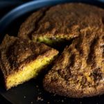 A slice being removed from the golden brown cornbread.