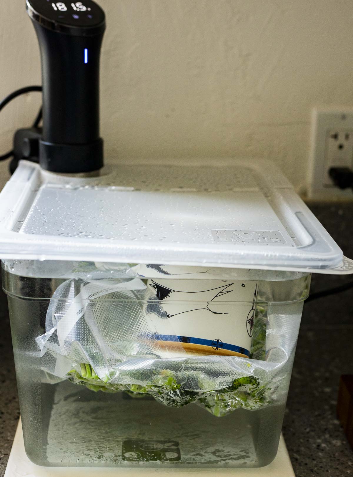 Broccoli cooking in the sous vide water bath.