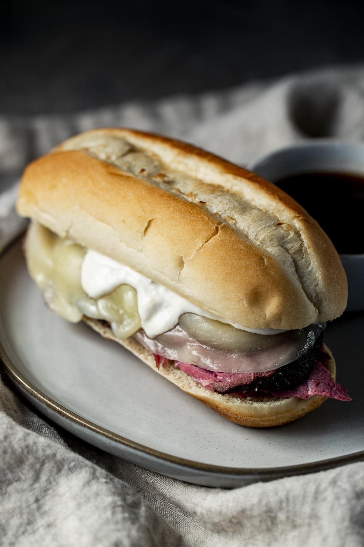 French dip made with sous vide beef on a plate.