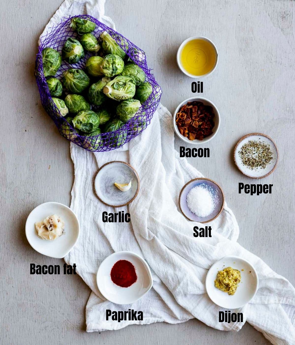 Ingredients to make sous vide Brussels sprouts arranged individually and labelled.