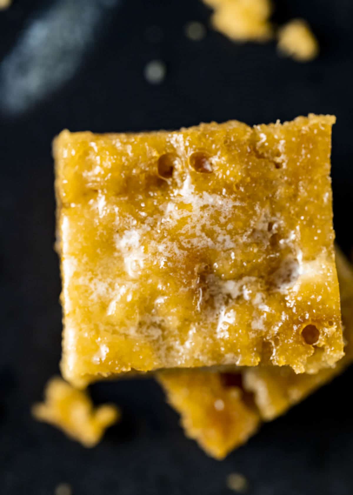 Overhead up close view of a square piece of cornbread.