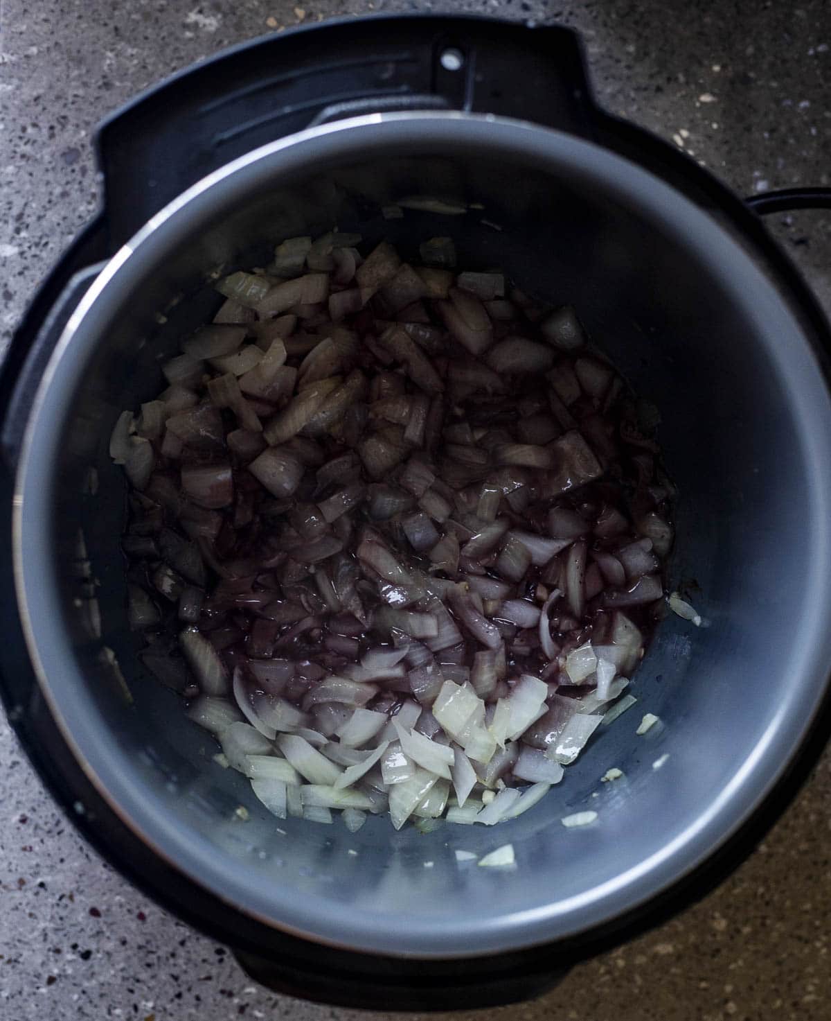 Onions and garlic cooked down with red wine in the Instant Pot.