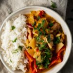 Pineapple chicken curry in a bowl with rice.