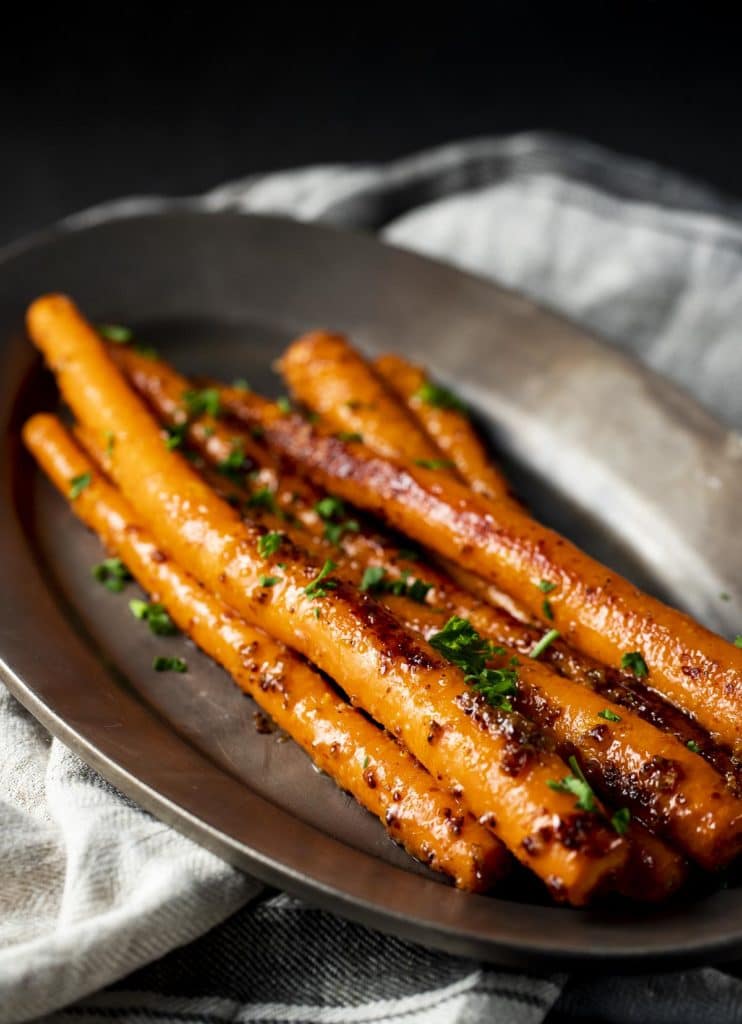 Sous vide carrots on a serving tray.