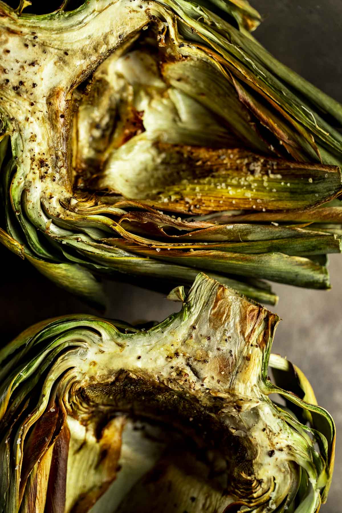 Up close view of air fried artichoke halves.