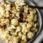 Overhead view of air fried cauliflower on a plate.