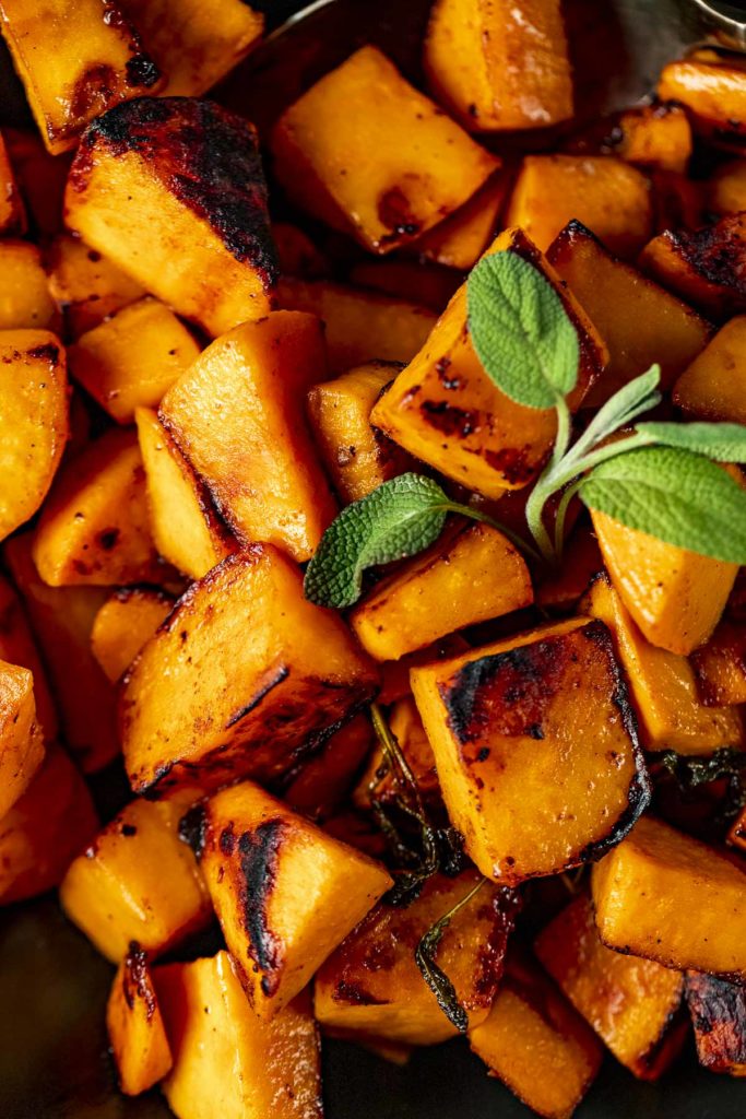 Close up of caramelized sweet potato cubes.