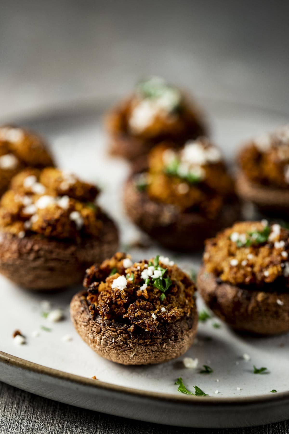 Side view of air fried stuffed mushrooms on a plate.