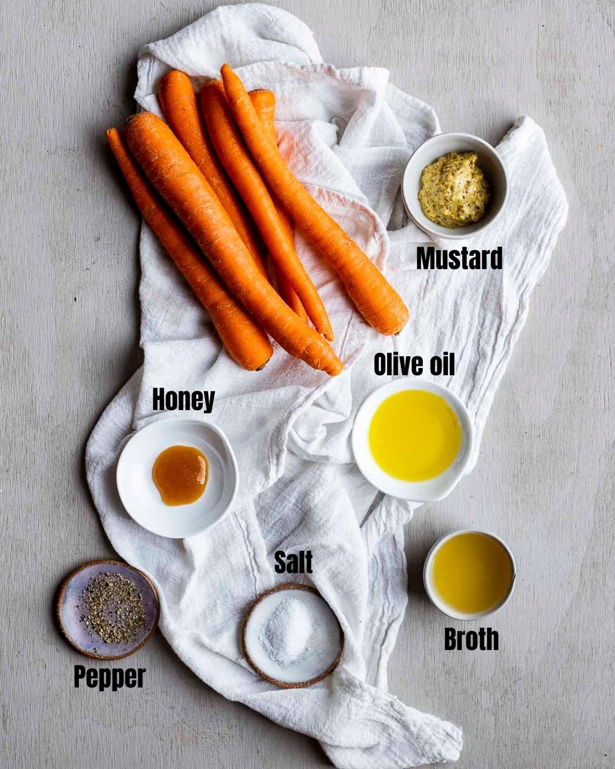 Ingredients to make Instant Pot carrots arranged individually and labelled.