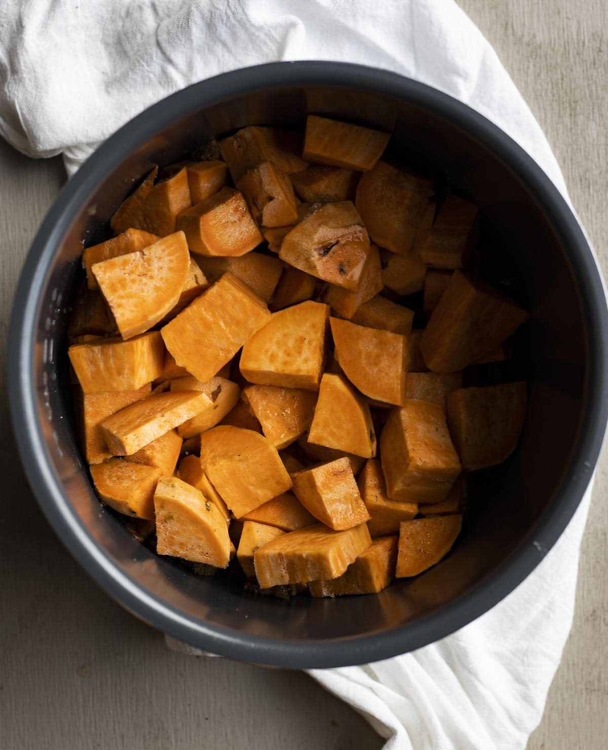 Cubed sweet potatoes in the Instant Pot insert.