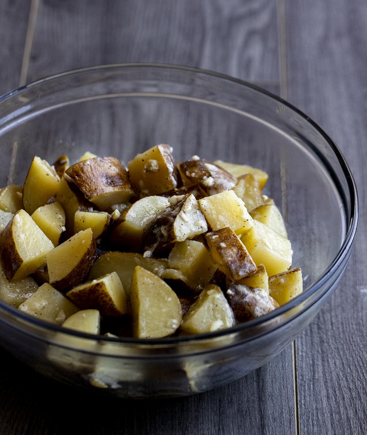 Cubed potatoes in a glass bowl.