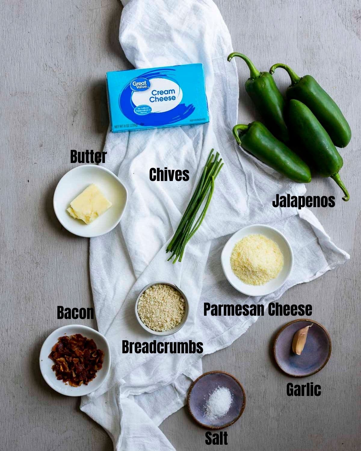 Ingredients to make jalapeno poppers arranged individually and labelled.