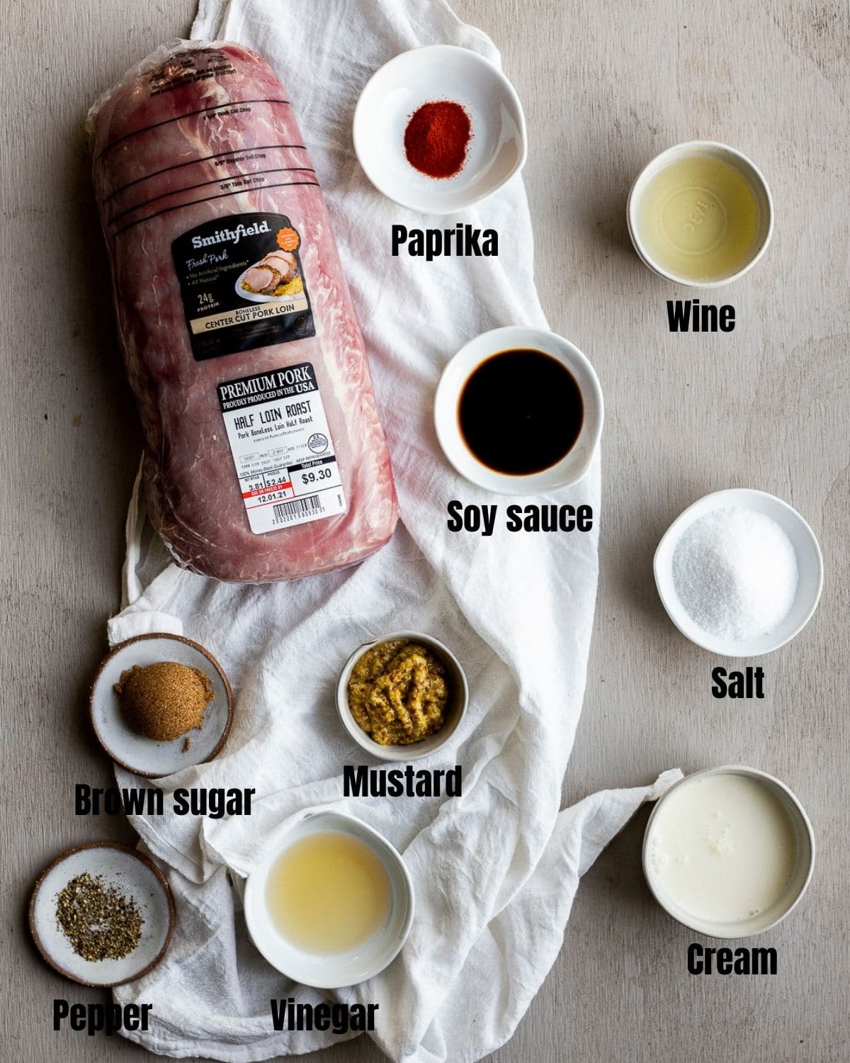 Ingredients to make sous vide pork loin arranged individually and labelled.